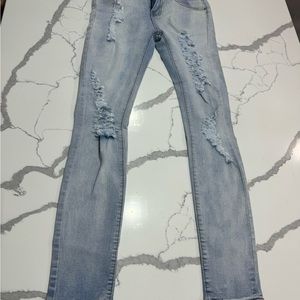 Women ripped blue jeans